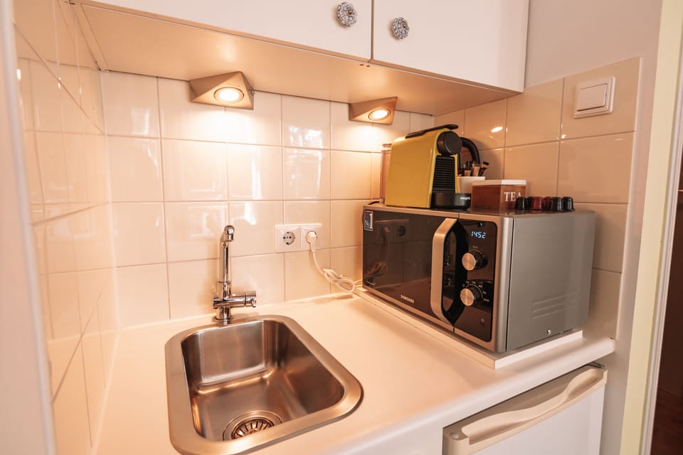 Design Double Room, City View | Private kitchenette | Fridge, microwave, espresso maker, coffee/tea maker