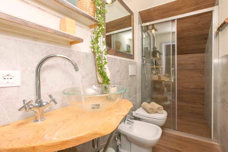 Honeymoon Double Room | Bathroom | Shower, hair dryer, bidet, soap