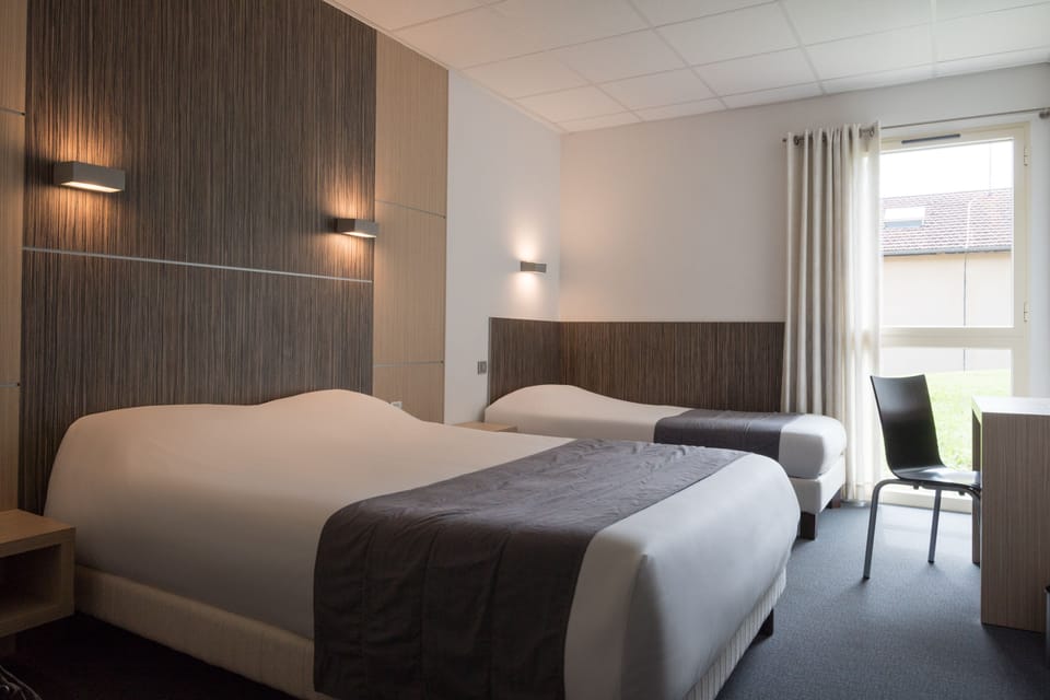 Comfort Triple Room, 1 Bedroom | Desk, laptop workspace, blackout drapes, iron/ironing board