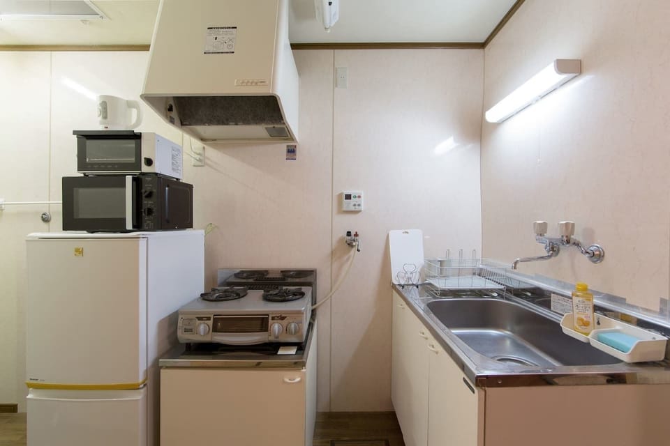 2 Bedrooms House | Private kitchen | Fridge, microwave, stovetop, cookware/dishes/utensils