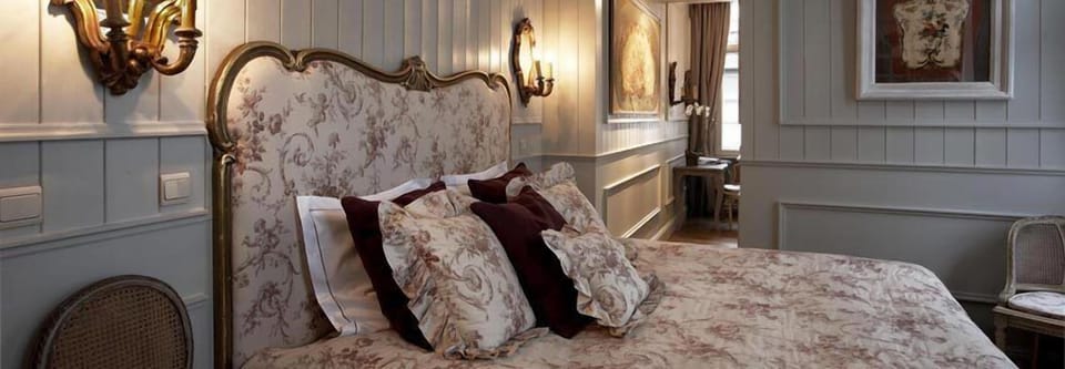 Executive Suite | Free minibar items, in-room safe, individually decorated, desk