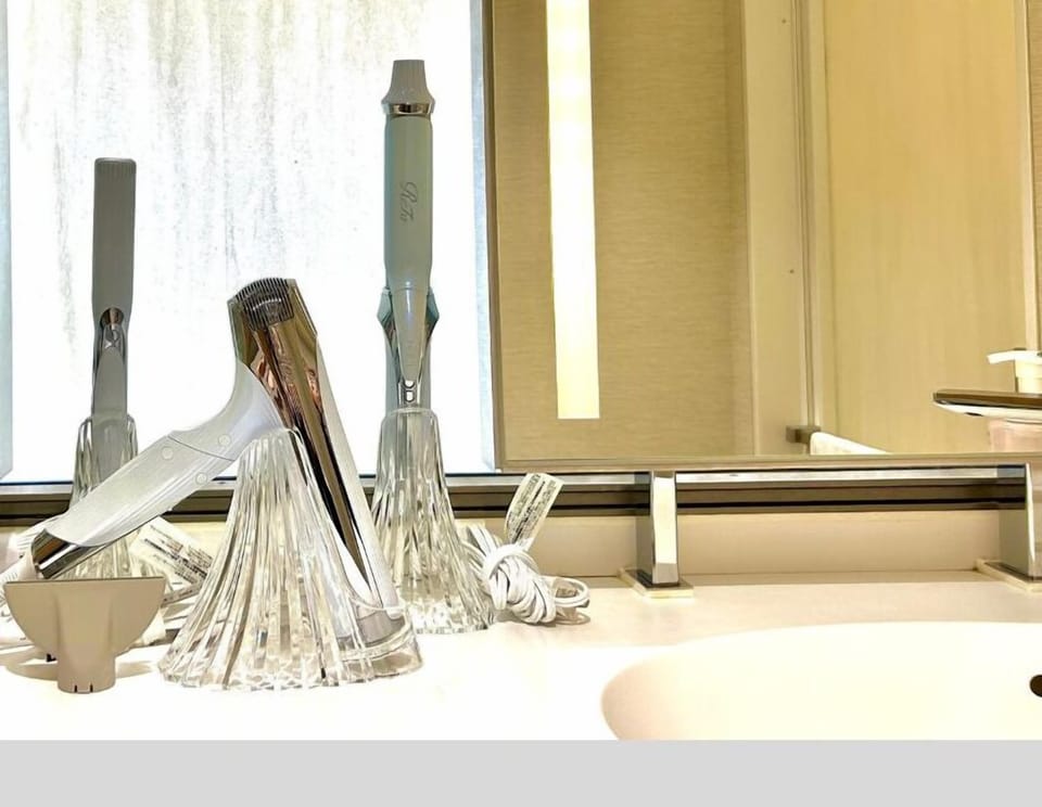 Separate tub and shower, free toiletries, hair dryer, slippers