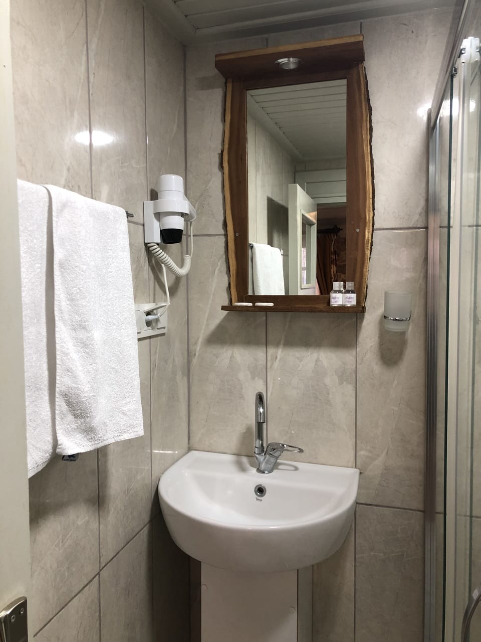 Shower, hair dryer, slippers, soap