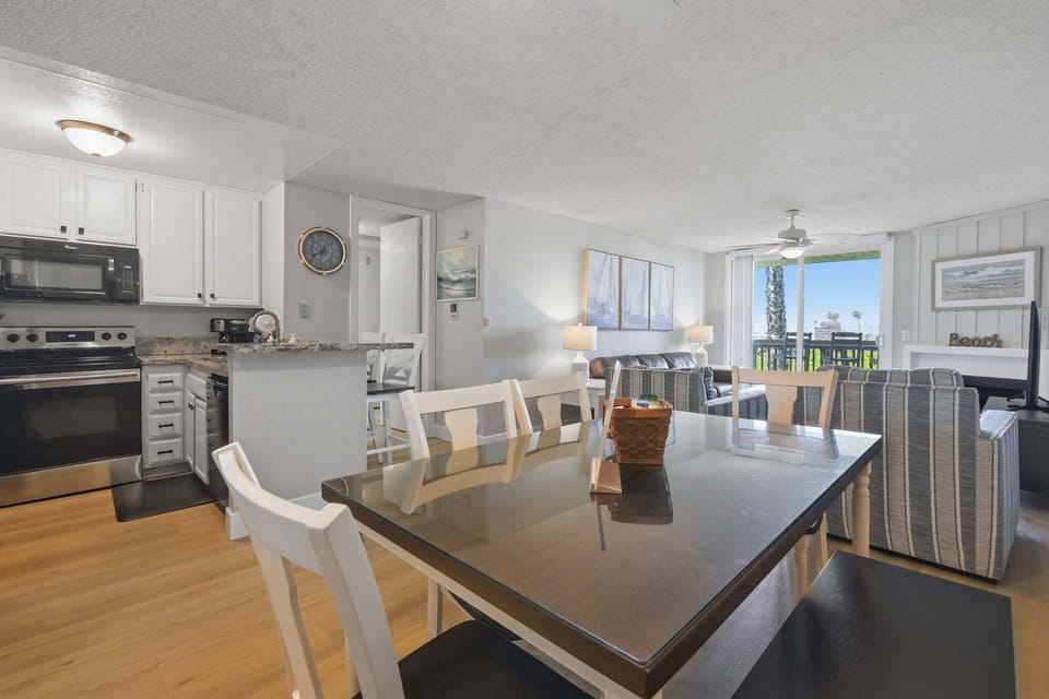 A well-equipped kitchen space that flows seamlessly into the dining area, creating a welcoming spot for meals with family or friends.