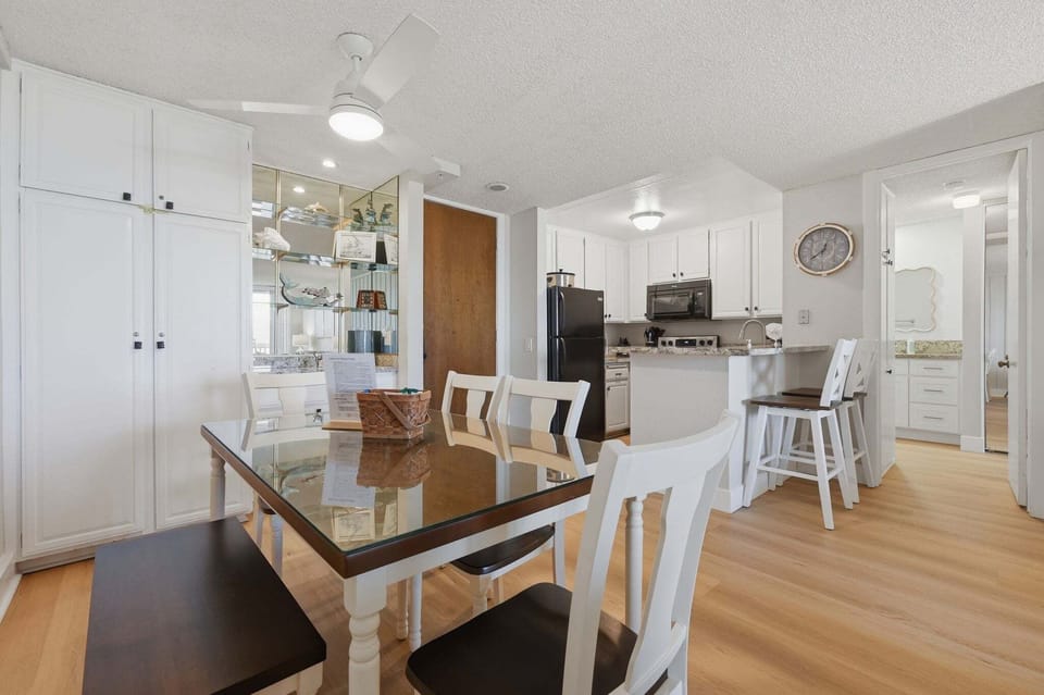 Positioned adjacent to the kitchen, this dining area features a welcoming table for six, allowing for a seamless transition between preparing meals and enjoying them together.