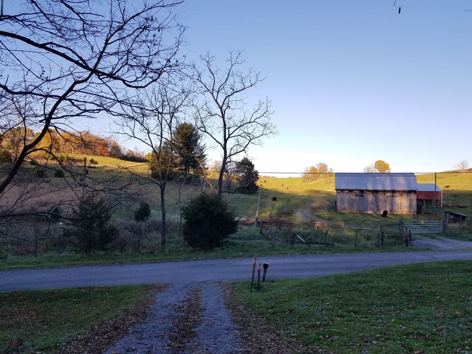 End of our Driveway with the sun going down on the farm across the road.
