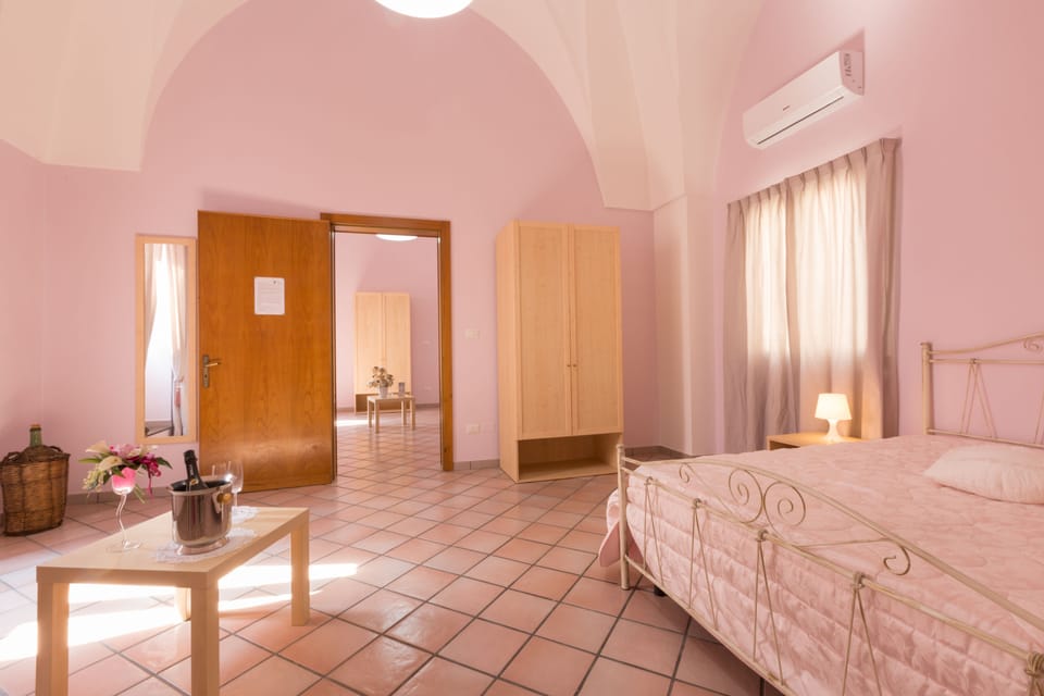 Deluxe Quadruple Room, Multiple Beds, Courtyard View (Rudhia) | 1 bedroom, down comforters, desk, laptop workspace
