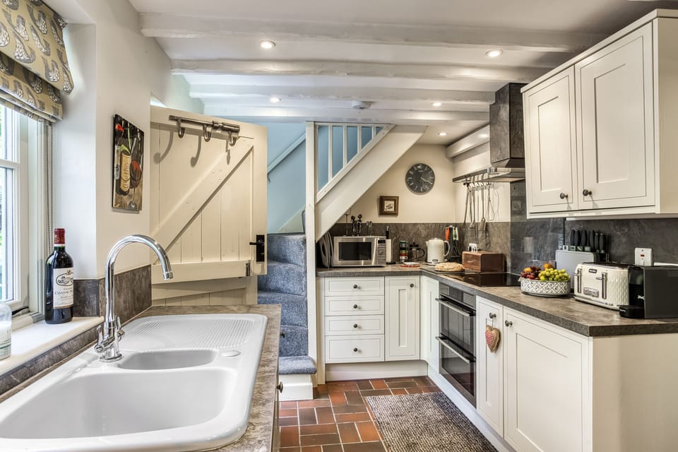 Natural light fills the well appointed kitchen.