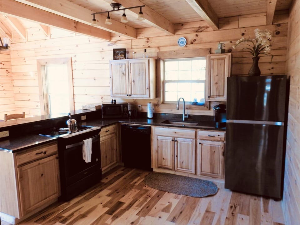 Kitchen with brand new black stainless steel appliances and granite countertops