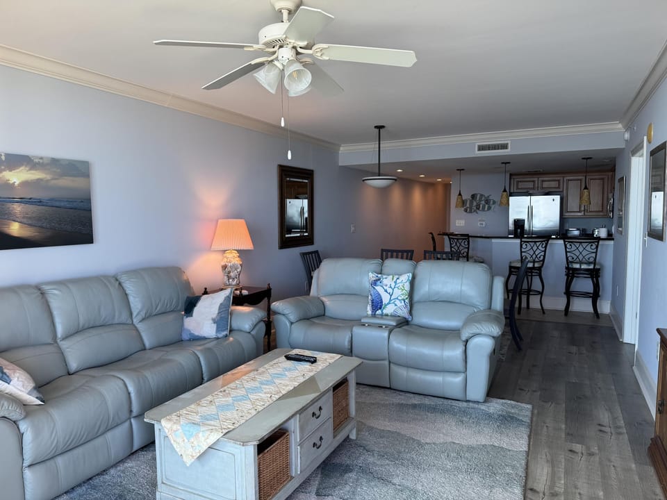 Cozy living room with plush seating and open kitchen view