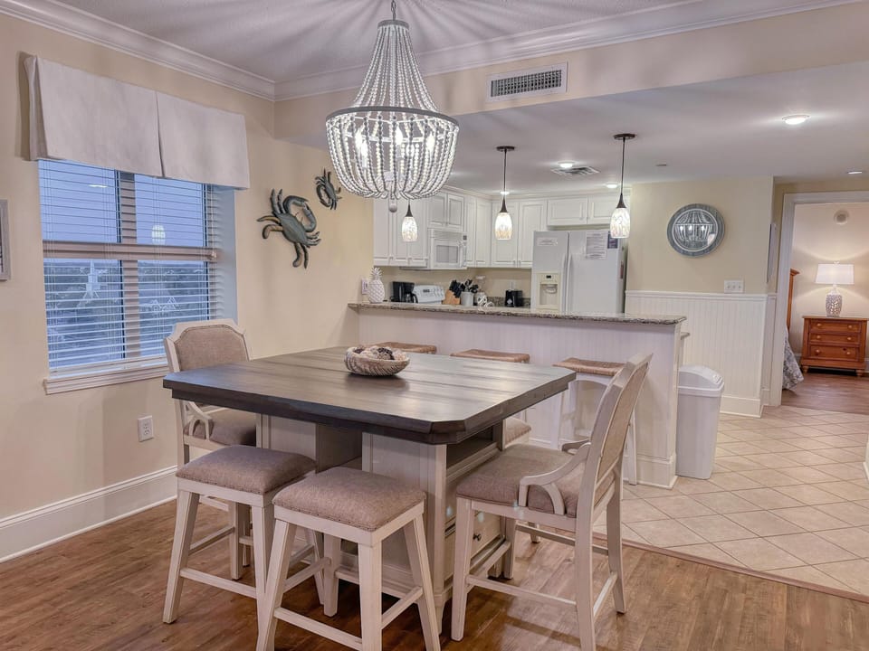 Bright, open kitchen and dining area with cozy seating