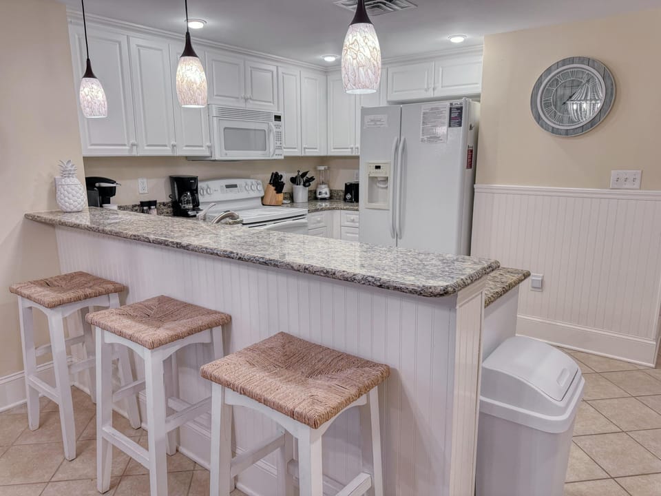 Bright, open kitchen with spacious breakfast bar seating