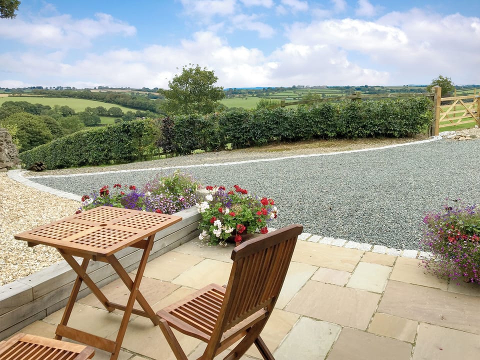 Sitting out area with countryside views | Trezeal Barn, North Hill