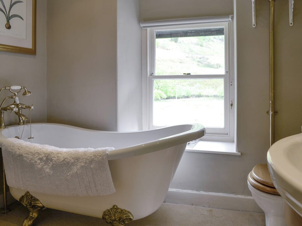 Bathroom with roll-top bath | Dol Y Clochydd, Llanfachreth, near Dolgellau