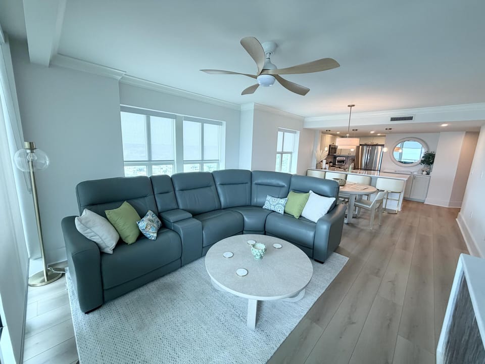 Spacious living room with cozy sectional and bright natural light