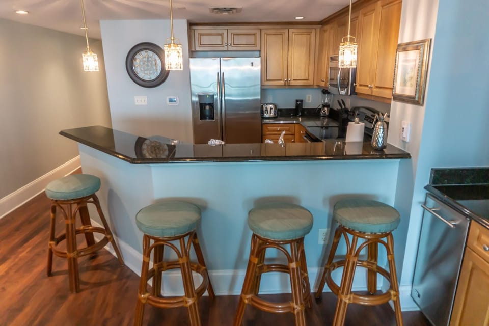 Cozy kitchen with breakfast bar and rustic wooden stools