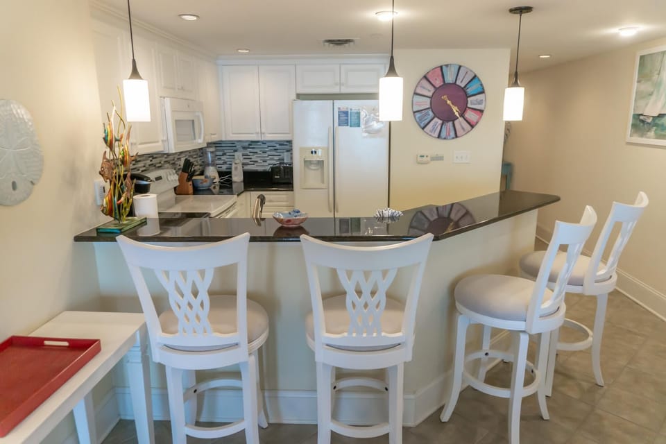Bright, open kitchen with spacious breakfast bar seating