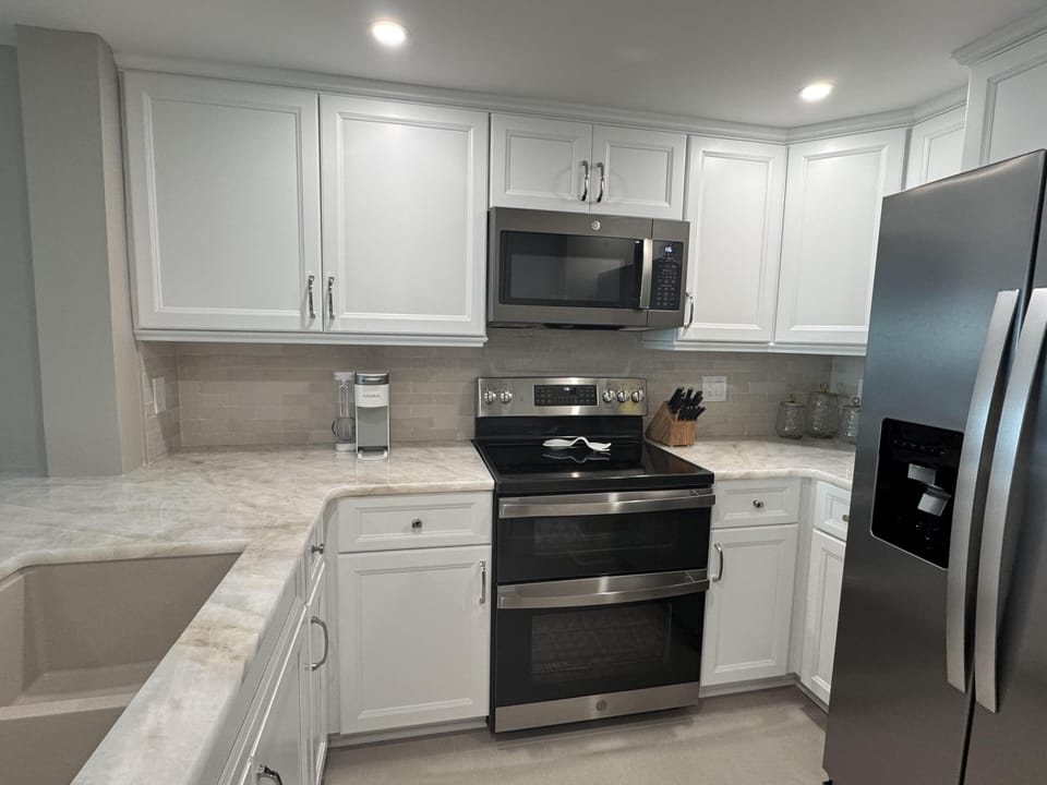 Modern kitchen with stainless steel appliances and sleek countertops