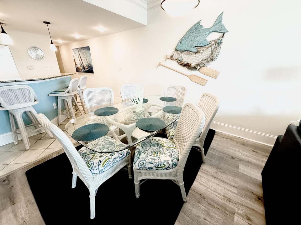 Bright dining area with ocean-inspired decor and bar seating