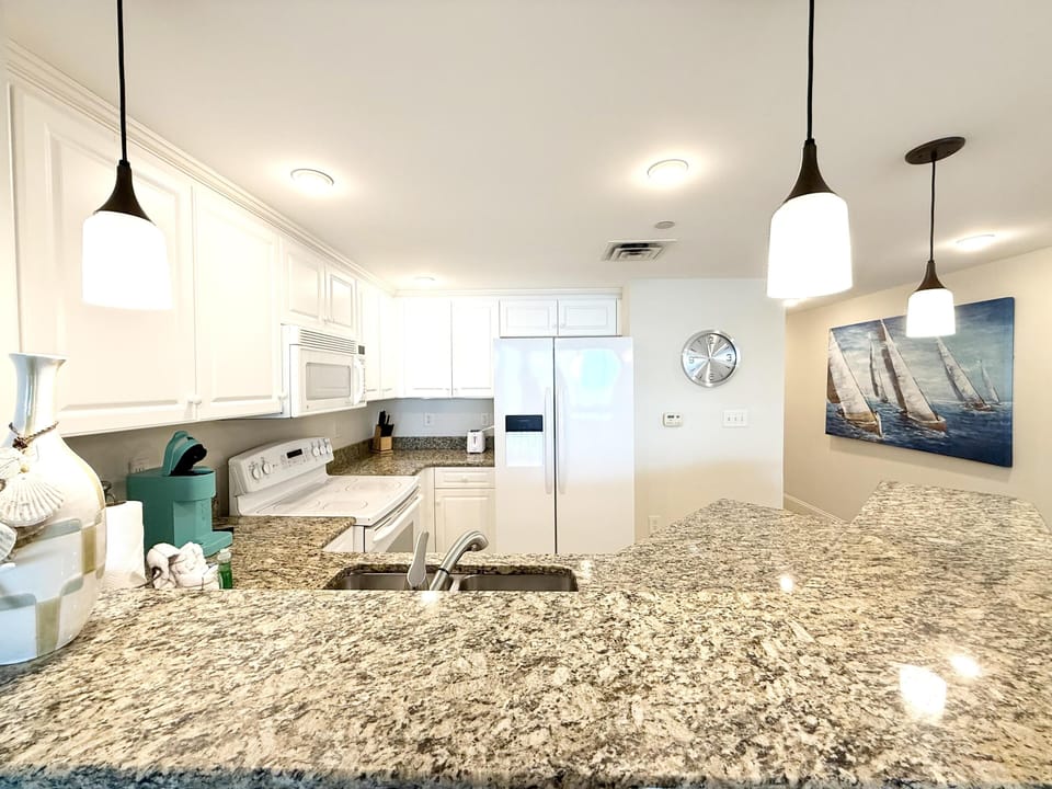 Bright, modern kitchen with spacious granite countertops