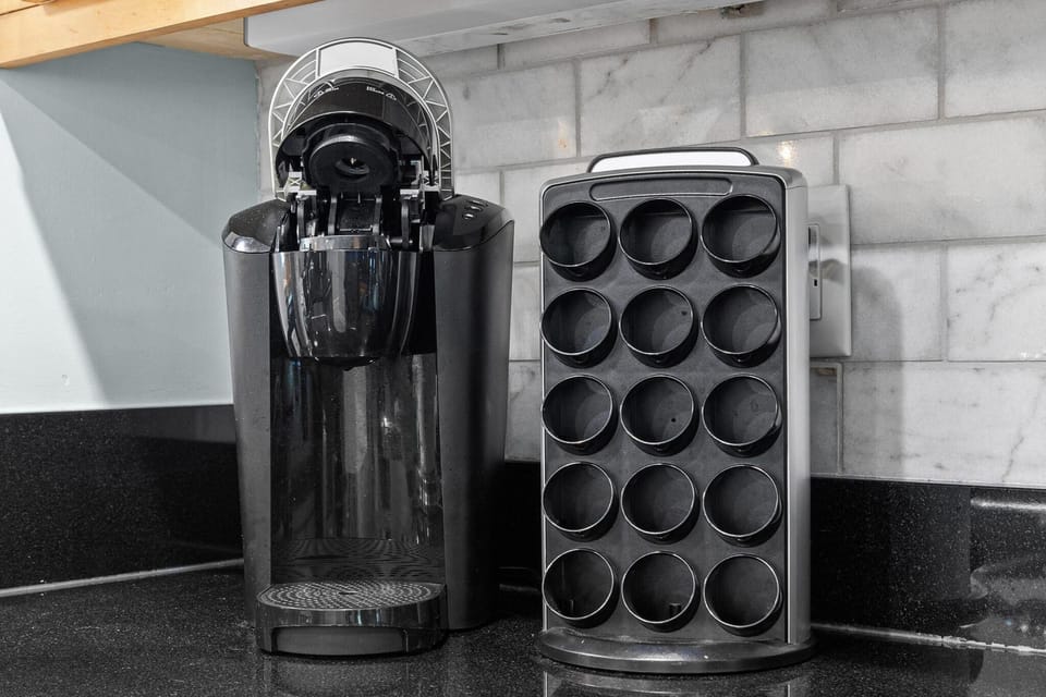 Sleek coffee station with convenient pod organizer in kitchen