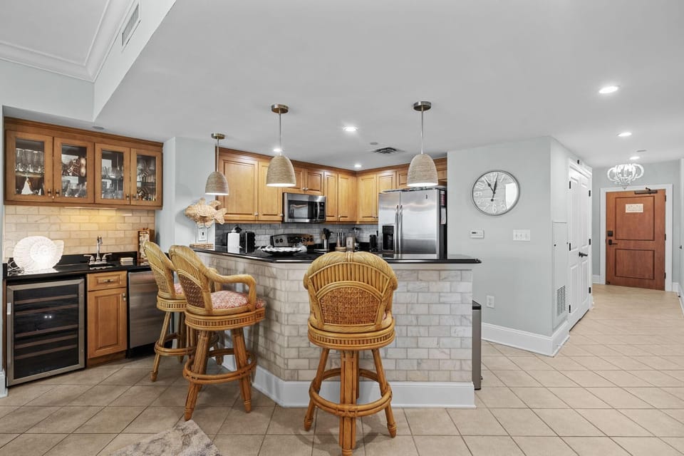 Spacious kitchen with cozy breakfast bar and ample storage