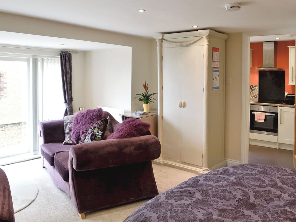 Double bed/ living area | Stable Cottage - Bodafon Hall, Llandudno