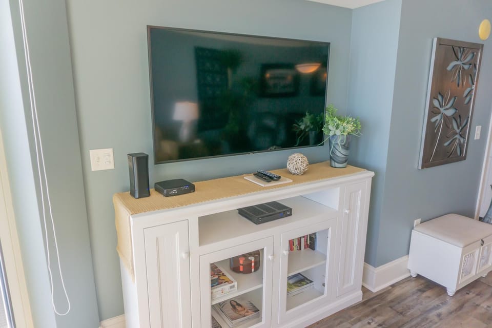 Cozy living room with stylish media console and calming decor