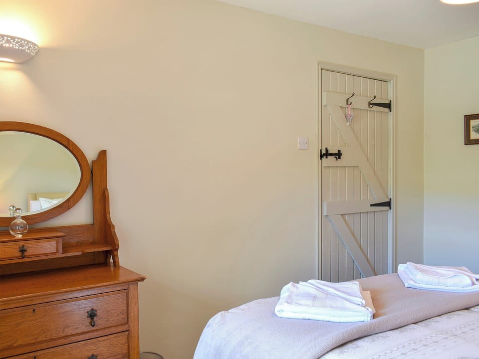 Relaxing bedroom with kingsize bed | 2 Swallowholm Cottages, Arkengarthdale, near Reeth