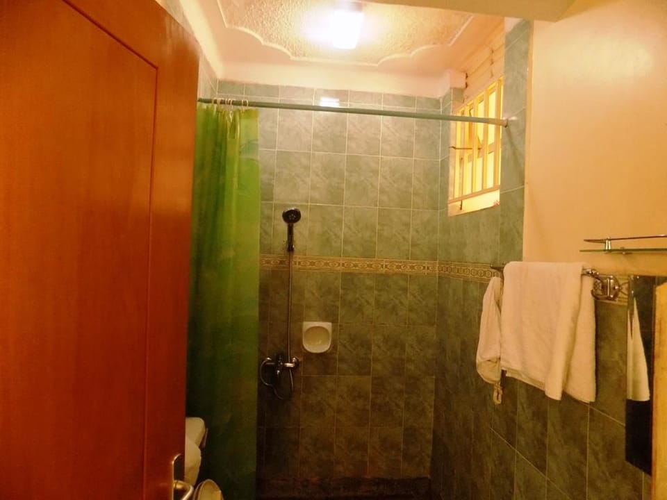 Shower, slippers, towels, soap