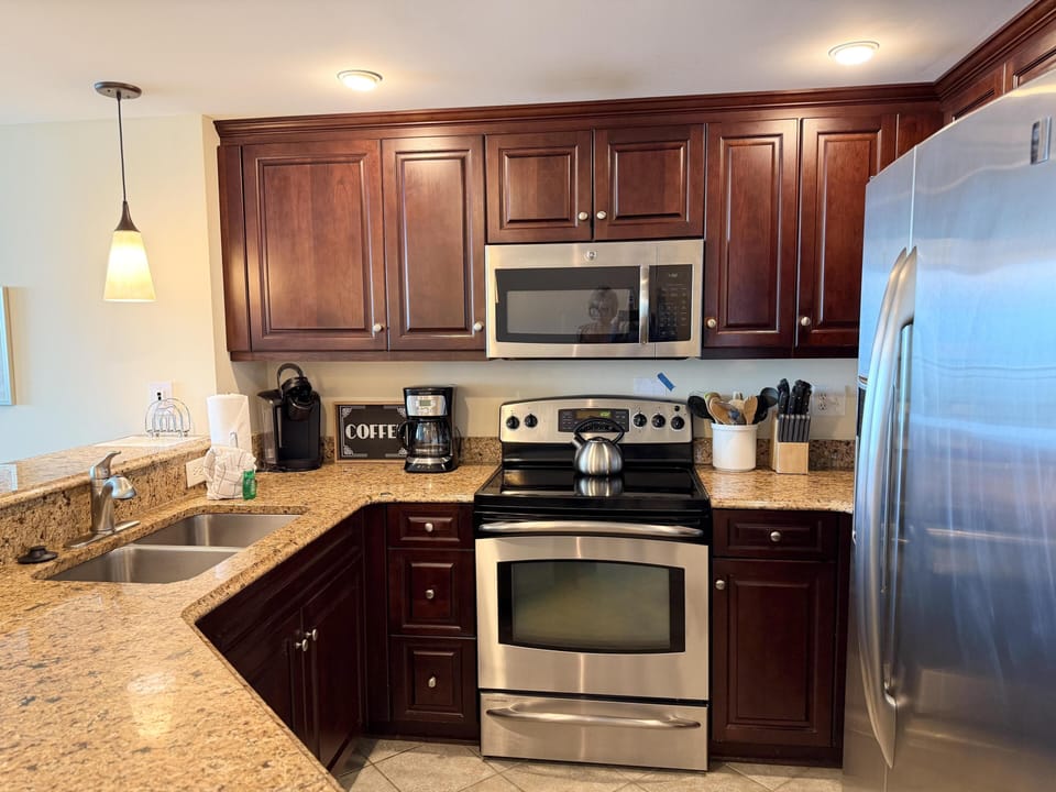 Modern kitchen with granite countertops and stainless steel appliances