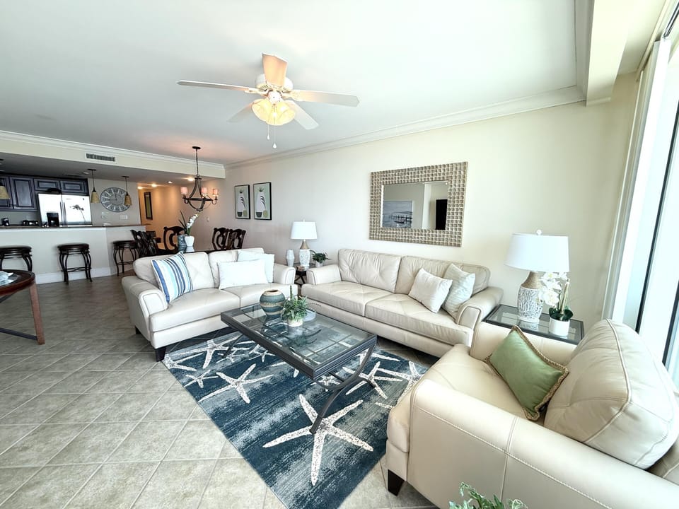 Spacious living room with coastal decor and ocean views
