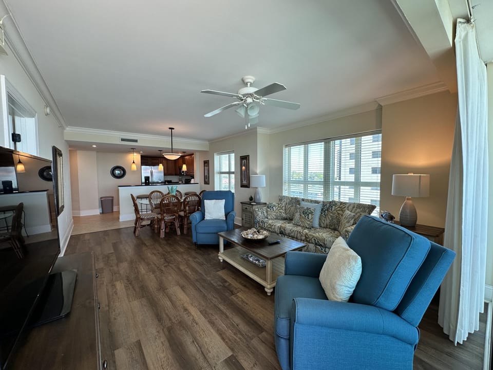 Spacious open living area with cozy seating and natural light