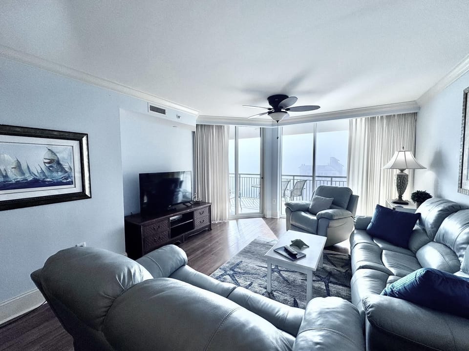 Cozy living room with panoramic city views and natural light
