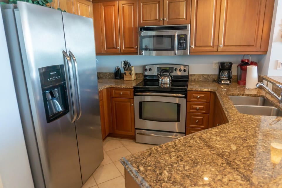 Modern kitchen with granite countertops and stainless steel appliances