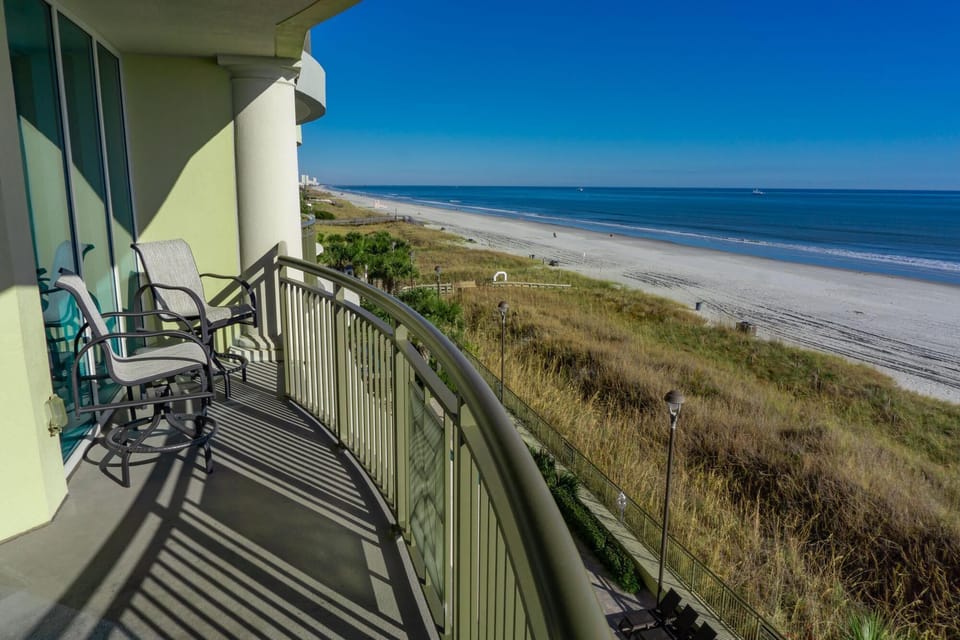 Oceanfront balcony with stunning beach and water views