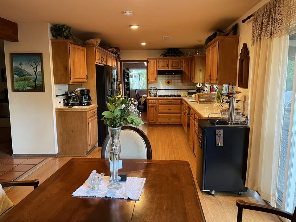Fully stocked kitchen, seen from family room.
