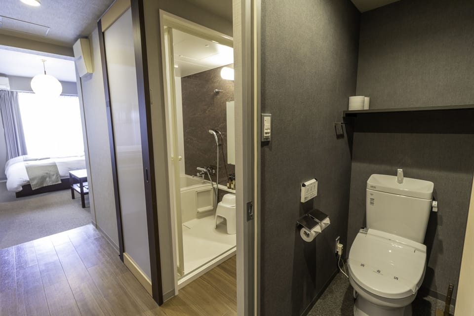 Combined shower/tub, free toiletries, hair dryer, slippers