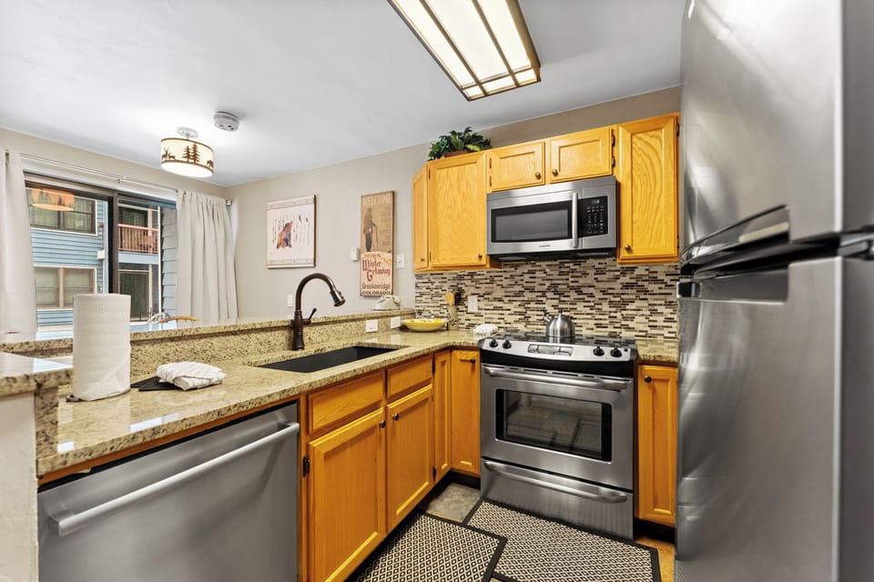 Your fully equipped kitchen features granite countertops, stainless steel appliances, and everything you need to prepare delicious meals during your stay.