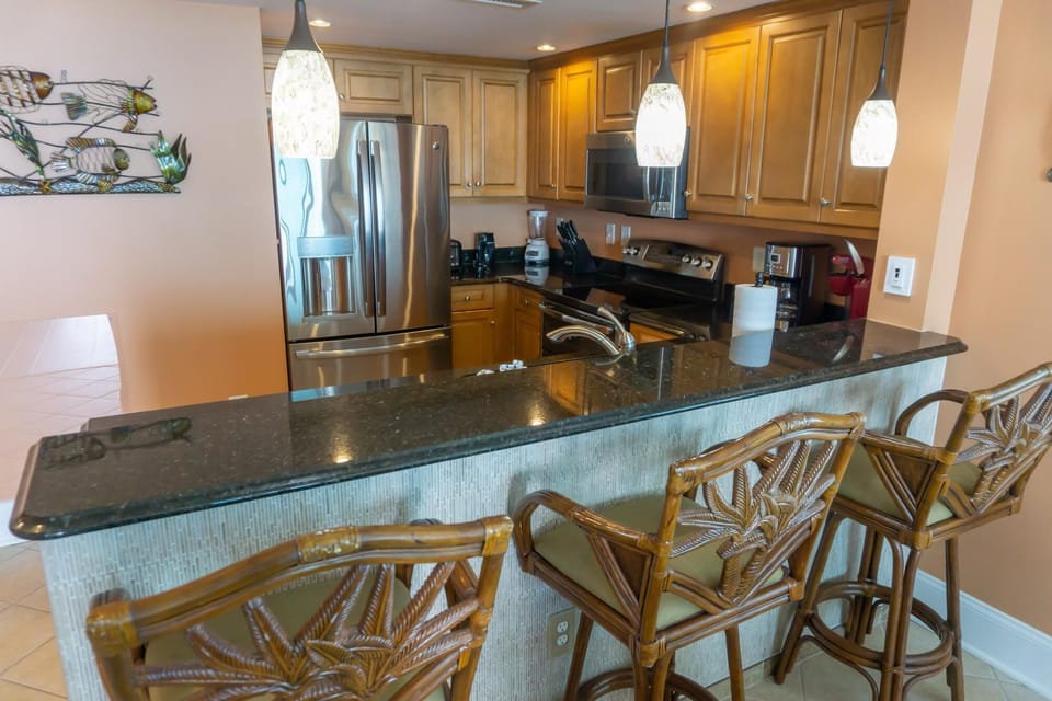 Cozy kitchen with granite countertops and casual seating