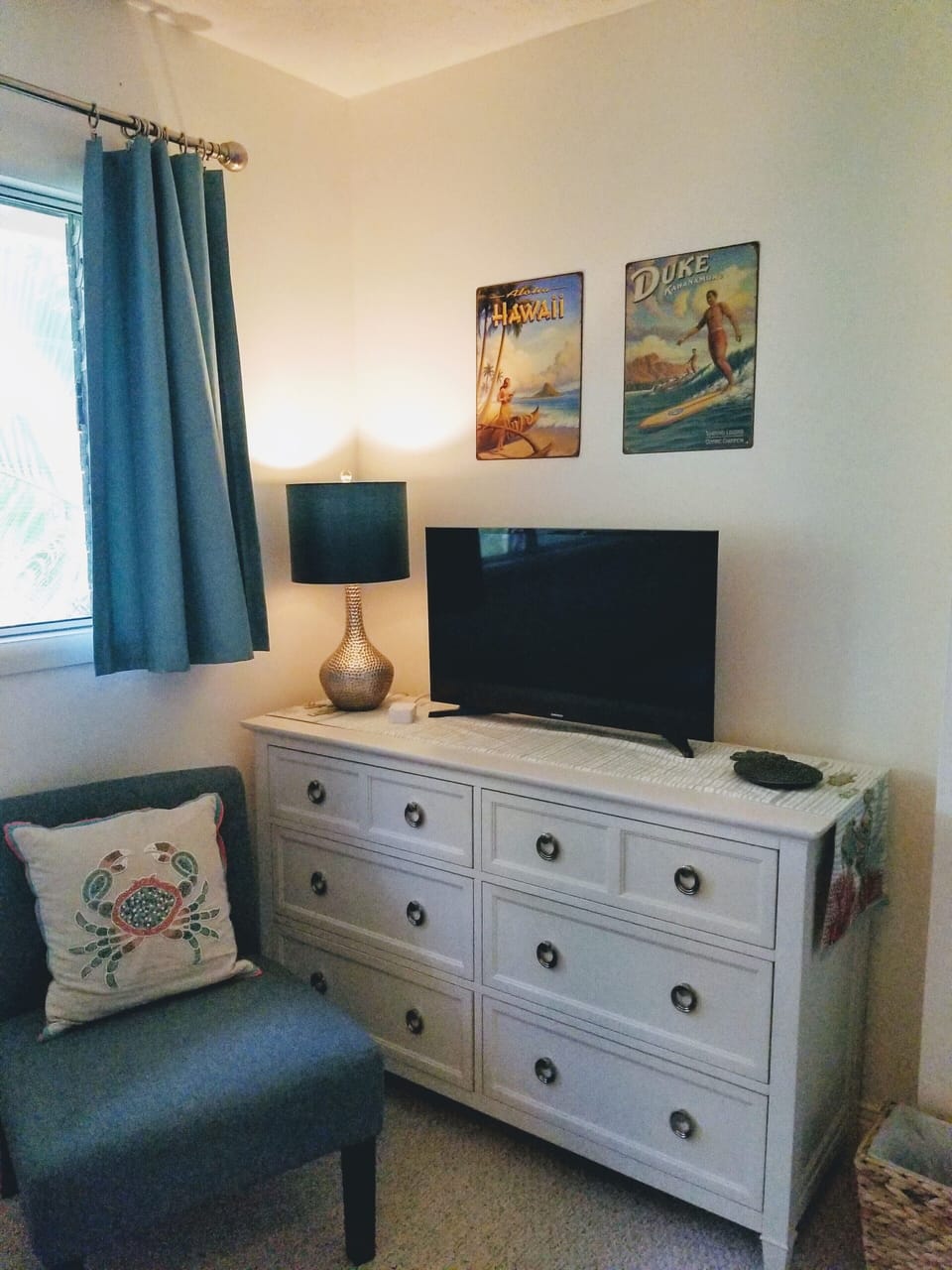 Guest room is filled wonderful linens, television, a tropical view and more!