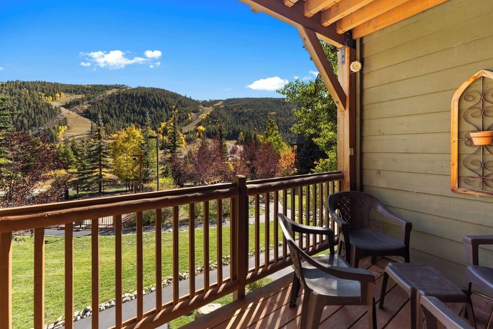 Unwind on your private balcony with stunning mountain views, where autumn colors paint the landscape and ski slopes beckon.