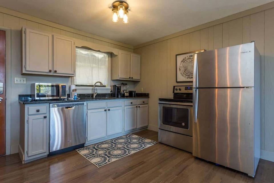 Stainless Steel Appliances And Granite Countertops In This Fully Stocked Kitchen!