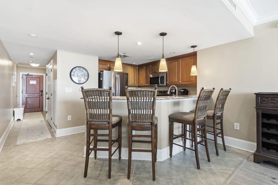 Spacious kitchen with breakfast bar and modern appliances