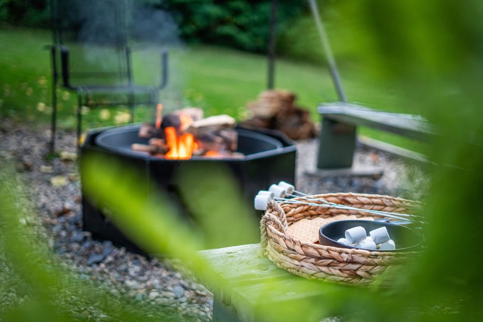 Gather around the fire pit in our cozy backyard for a delightful evening of making s'mores and sharing stories under the stars.