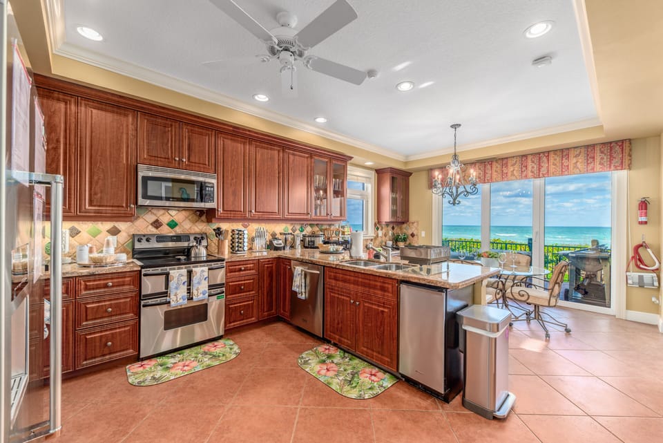Newly renovated chef's kitchen with ocean views and outdoor grilling station