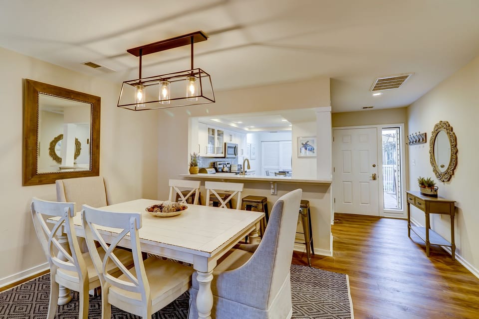 Dining room opening up to kitchen and entry way