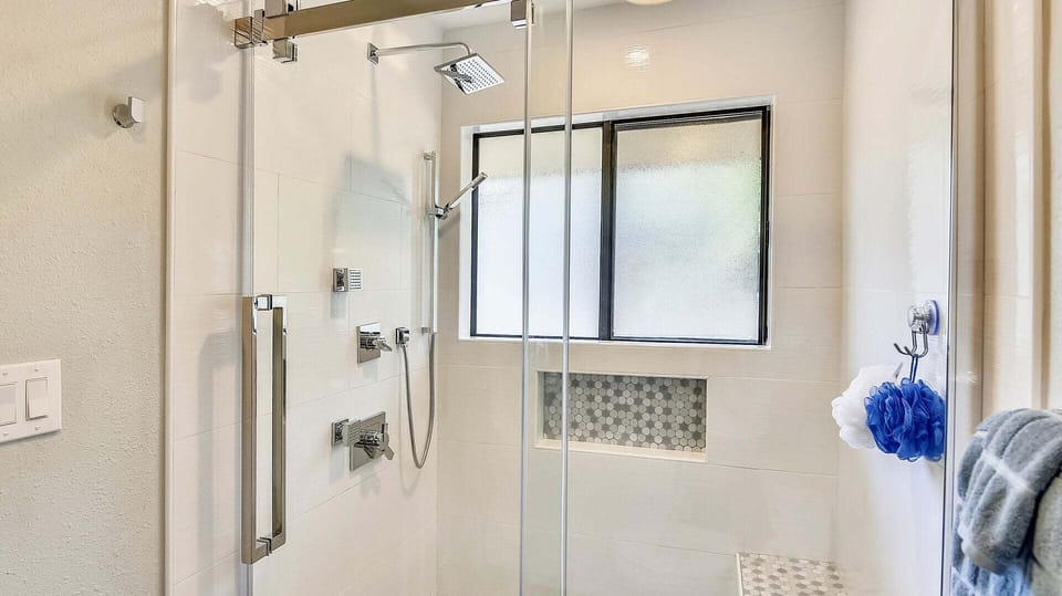 Walk-in shower in the primary ensuite bathroom