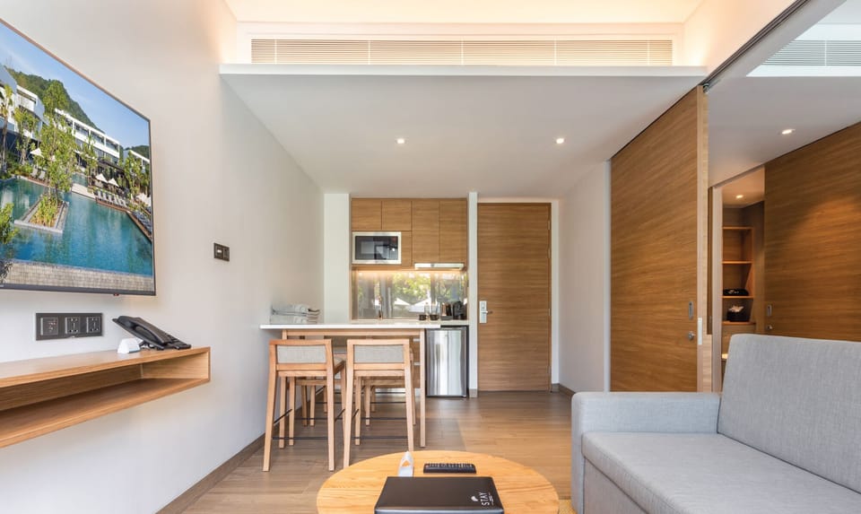 One Bedroom Suite Garden View | Living room | 55-inch LED TV with satellite channels, TV