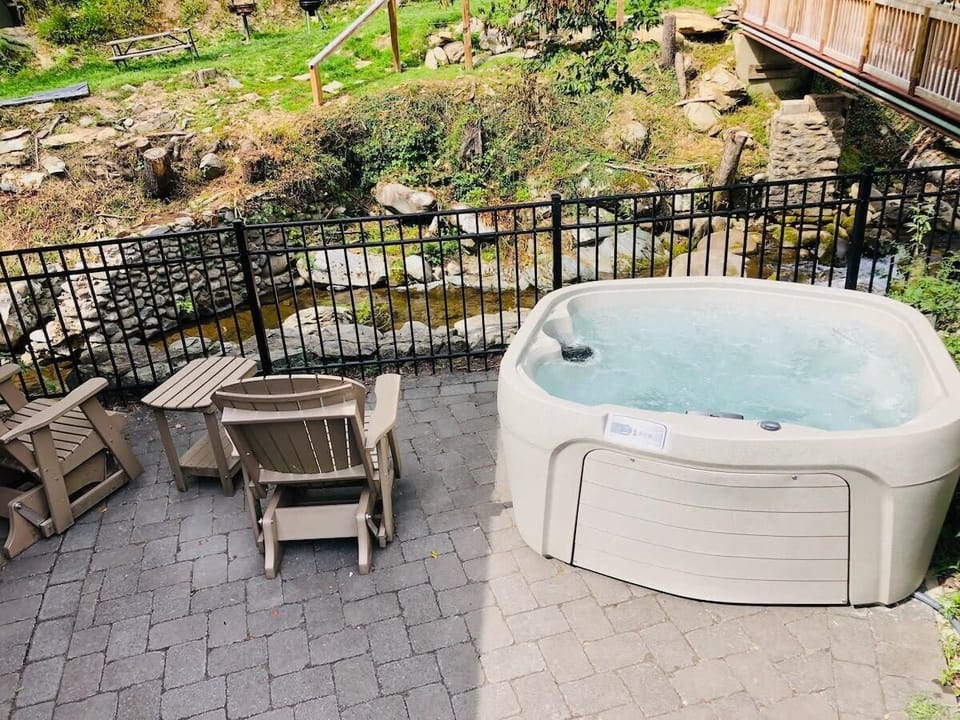 Hot tub with a gorgeous view of the water!  Enjoy the sounds!